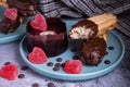 Valentinesday cupcake. Dark chocolate coated digestive biscuit . Sweet delicious dessert truffle and heart shaped candy on a plate