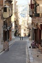 Valeta, Malta, August 2016. A typical shady street of the islandÃ¢â¬â¢s capital, old houses and shops. Royalty Free Stock Photo