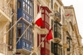 Old town buildings with national flags, Valetta