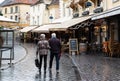 Valkenburg, Limburg, The Netherlands - Senior tourist couple walking in the commercial streets of old town