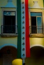 VALLADOLID, MEXICO - NOVEMBER 12, 2017: Outdoor view of a building with a mexican flag hanging in the facade in a Royalty Free Stock Photo