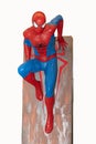 Valladolid, Spain - march 8, 2020 : Spider-Man model sit down is isolated on white background of character from Spiderman movie