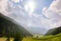 Valle d'Aosta, Italy: meadows, woodland and mountain range Royalty Free Stock Photo