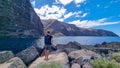 Valle Gran Rey - Man on scenic coastal hiking trail from Vueltas to Playas de las Arenas along massive cliffs in Valle Gran Rey