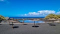 Valle Gran Rey - Scenic sea view on beach Playa Charco del Conde without people in Valle Gran Rey, La Gomera. Sun umbrellas