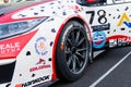 Close up of Hankook tire name logo on touring racing car on asphalt track