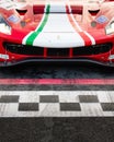 Ferrari GT racing touring car front detail on asphalt circuit starting line Royalty Free Stock Photo