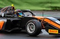 Formula regional racing car with safety protection halo detail while racing
