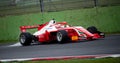 Spectacular view of Formula regional racing car spraying water on wet