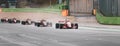 Wet race group of alogned formula racing cars asphalt straight track