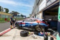 Hyundai Team electric racing car tuning work in circuit pit lane