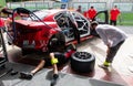 Romeo Ferraris Team work on electric racing car in circuit pit lane