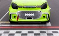 Smart car electric race starting grid detail front view on checkered sign