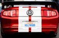 Ford Mustang with California Hollywood sign rear view shiny red american sport cars