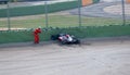 Marshal rescuer thumbs up checking racing car driver safety after