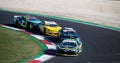 Nascar cars battle challenging on asphalt racetrack, overtaking at turn