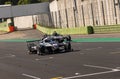 Prototype cars racing on circuit