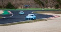 Porsche Carrera challenge touring race car on asphalt racetrack circuit