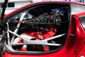Race car driver in cockpit ready for start with racing suit safety
