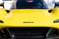 Supercar design front view hood with logo and brand name, yellow Dallara