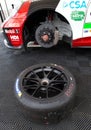 Unmounted Michelin tire on race car Porsche visible brake mechanical