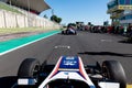 Driver point of view in car racing starting grid