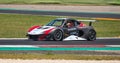 Lotus Exige sport racing supercar action on asphalt track side view