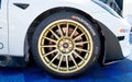 Close up of Hankook racing tire with logo mounted on Tesla electric car