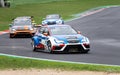 Cupra TCR touring race car in action on racetrack