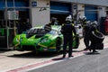 Endurance championship. Lamborghini Huracan car pit stop with team people in action