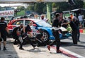 Racing touring car Hyundai in circuit pit lane with team people mechanics at work