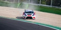 Cupra TCR in gravel trap out of track at turn on asphalt circuit