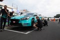 Touring car championship. Hyundai I30 car on starting grid position with team people