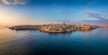 Valletta, Malta - Aerial panoramic skyline of Valletta at sunrise with Our Lady of Mount Carmel church