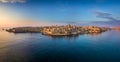 Valletta, Malta - Aerial panoramic skyline of Valletta at sunrise with Our Lady of Mount Carmel church