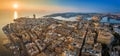 Valletta, Malta - Aerial panoramic skyline view of Valletta at sunrise with cruise ship entering at Grand Harbor.