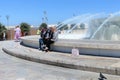 Valletta, Malta, August 2019. People of the island. Muslim women take pictures at the fountain.