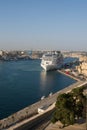 Valletta, Malta, August 2019. A vertical view of a ferry approaching a pier.