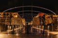 Valletta,Malta.Evening pedestrian walking street illuminated by colorful lights,people in motion.Night city life.Street festive