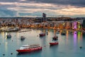 Valletta, Malta - January 11, 2019: Tourists boats in the harbor of Sliema on Malta at dusk