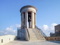 Siege Bell War Memorial near to Park Lower Barrakka Gardens in Valletta city, Malta Royalty Free Stock Photo