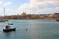 Valletta, Malta, July 2014. View of the historic part of the city with a dome of a Catholic cathedral from the side of the bay.