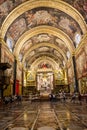 Nave and tombstones with altar in background in Valletta Cathedral, Malta