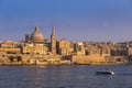 Valletta, Malta - Motorboat and the famous St.Paul`s Cathedral w