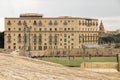 Valletta, 16th century  fortification with a football pitch,  and view of Floriana town with Phoenicia hotel and St Publius church Royalty Free Stock Photo