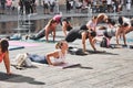 Valletta, Malta - October 08 2022: A large group of women doing street yoga exercises in a public square