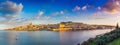 Valletta, Malta - Panoramic skyline view of the ancient city of Valletta and Sliema at sunrise shot from Manoel island at spring