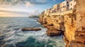 Valletta, Malta: skyline from Marsans Harbour at sunrise warm lights