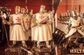 Souvenir figurines of knights in armor with weapons, as a symbol of Malta`s ancient successes