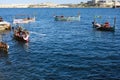 Valletta, Malta 03/06/2020 Water taxis dgÃÂ§ajsa tal-pass taking tourists from Grand Harbour to Fort St Angielo and Birgu Royalty Free Stock Photo